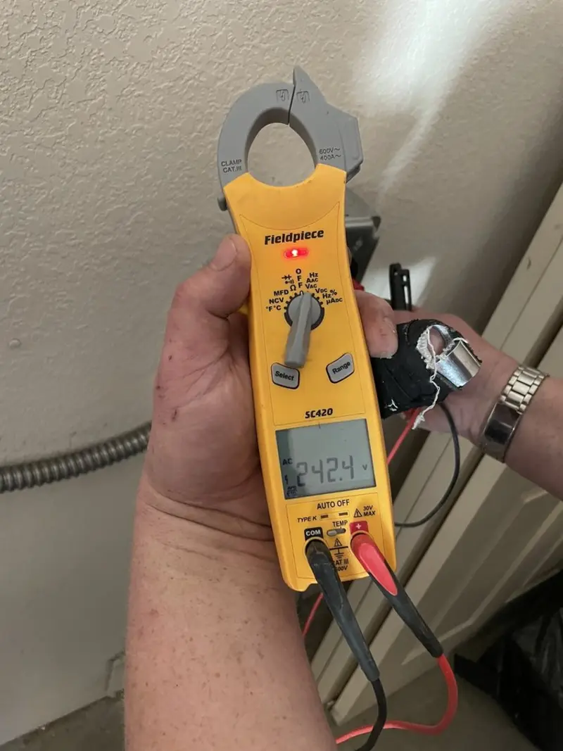 Voltage testing with clamp meter during Recessed Lighting Installation in L'Anse
